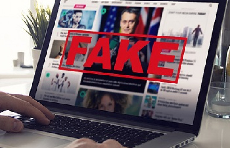 240301 Fake News Computer Screen Reading Fake News
