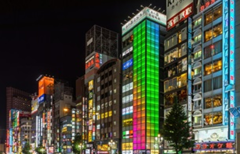 260302 Colorful illuminated facades of buildings at night with green blue and pink lights Kabukicho Shinjuku Tokyo
