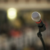 260811 Microphone on stand in front of blurry background